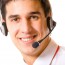 Portrait of happy support operator in headset, isolated